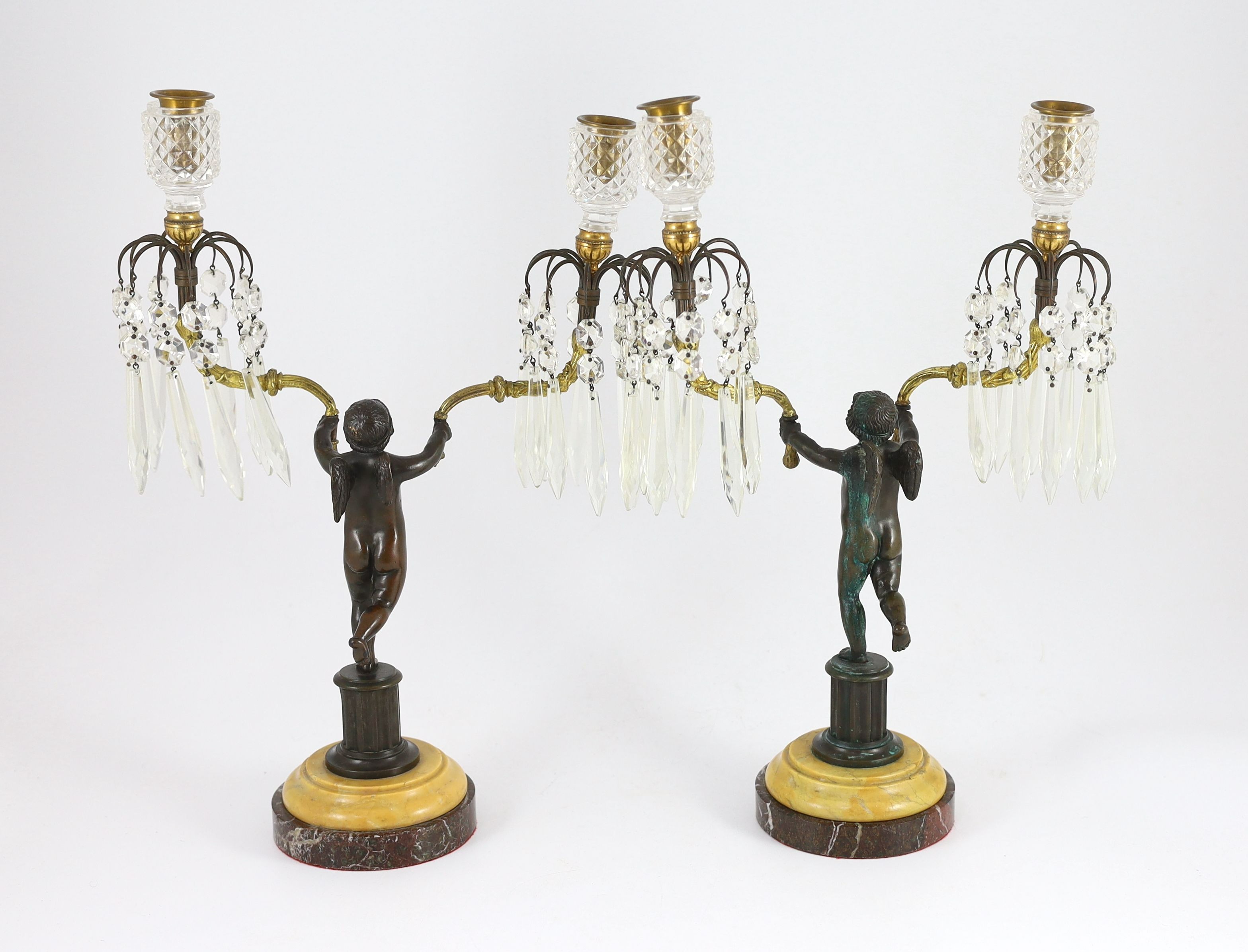 A pair of early 19th century bronze and ormolu figural candelabra, width 30cm, height 42cm